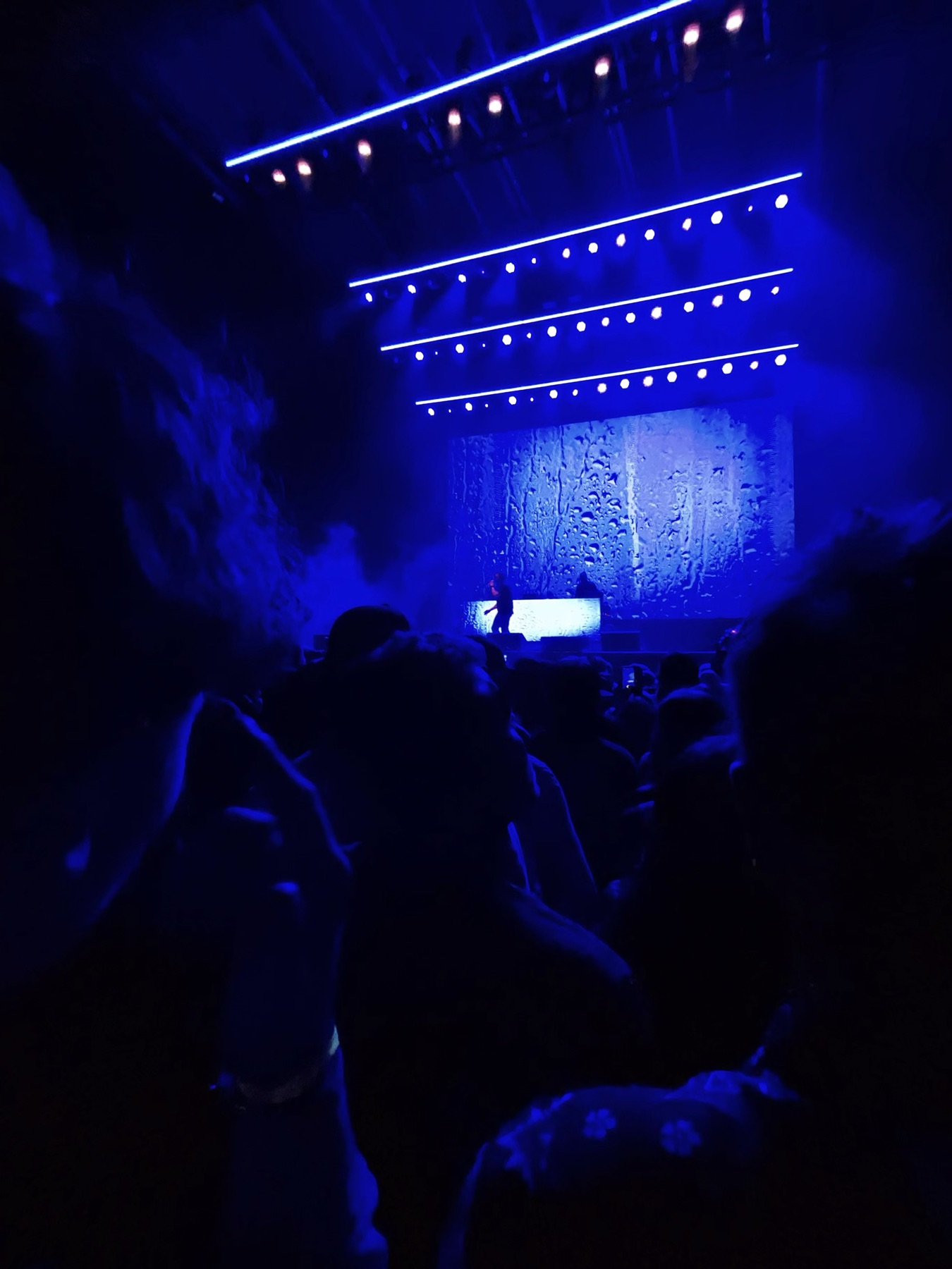 Blue light and haze over the audience at the Grandstand